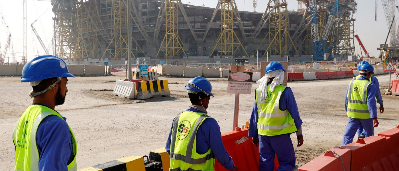 Workers walk towards the construction site of the Lusail stadium which will be build for the upcoming 2022 Fifa soccer World Cup during a stadium tour in Doha, Qatar, December 20, 2019.  REUTERS/Kai Pfaffenbach